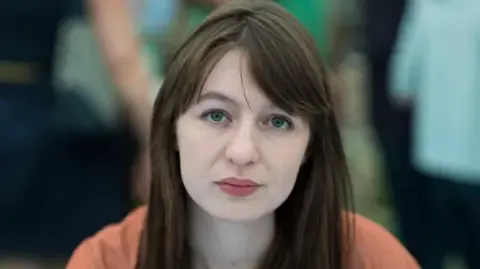 Irish author Sally Rooney states she will not enter the UK over potential arrest